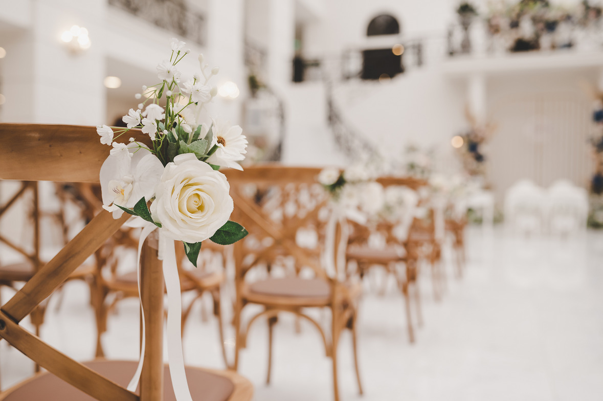 View of wedding ceremony with a rose on the chair